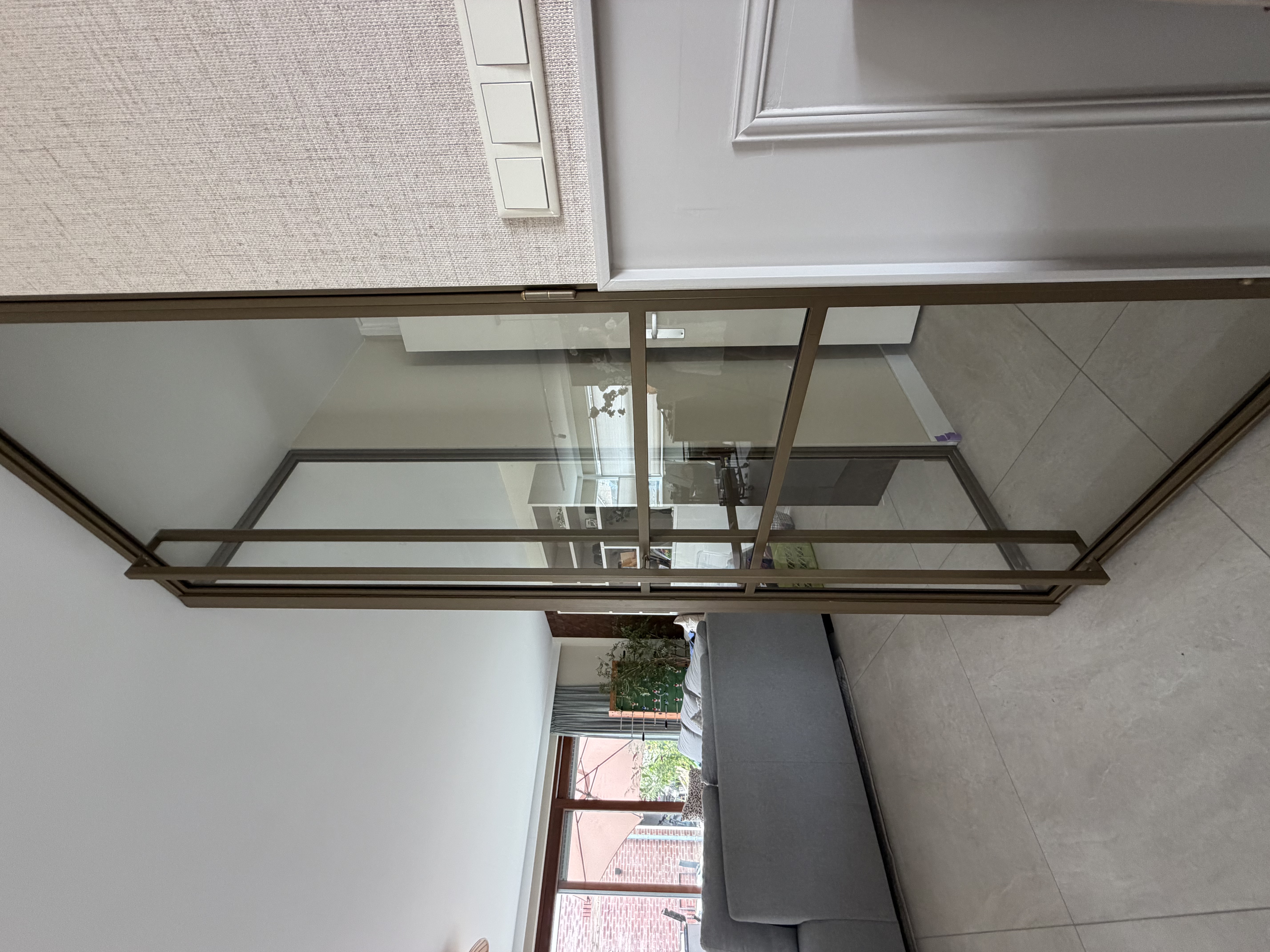 Stalen scharnierdeur Medium Brons met zijlicht, Alblasserdam — volledige deur en warme bronzen finish